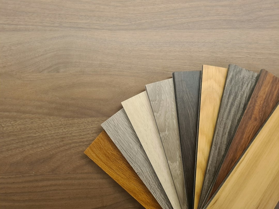 Fanned out flooring samples show wood grain and color.